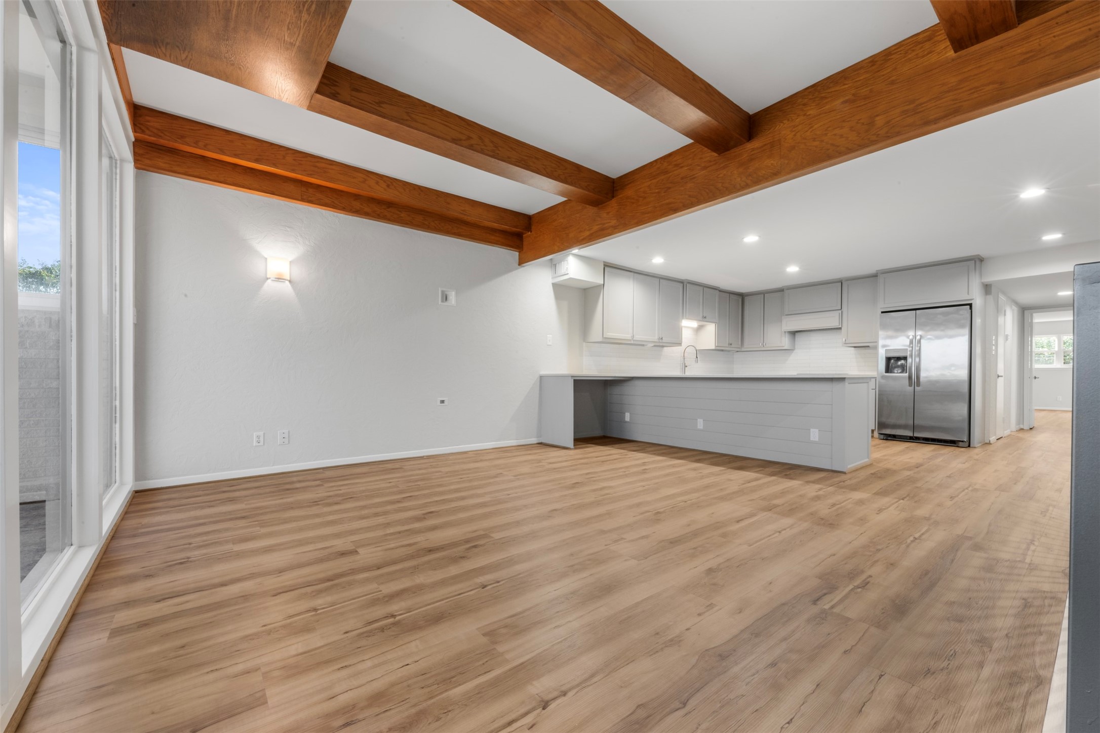 3141 Bissonnet Street Houston, TX 77005 - Photo 19 of 45 a view of an empty room with a kitchen