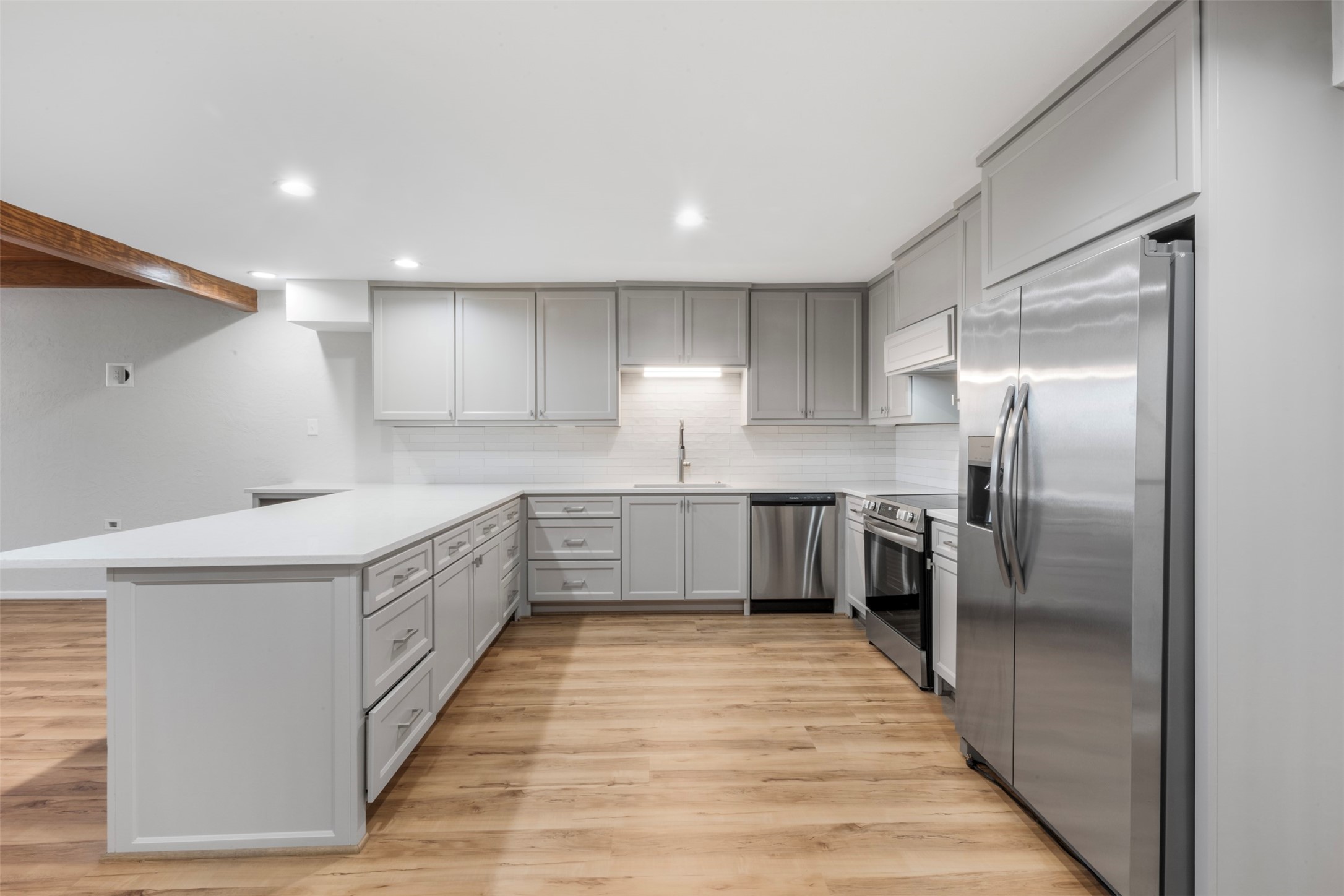 3141 Bissonnet Street Houston, TX 77005 - Photo 23 of 45 a kitchen with stainless steel appliances sink a microwave and cabinets