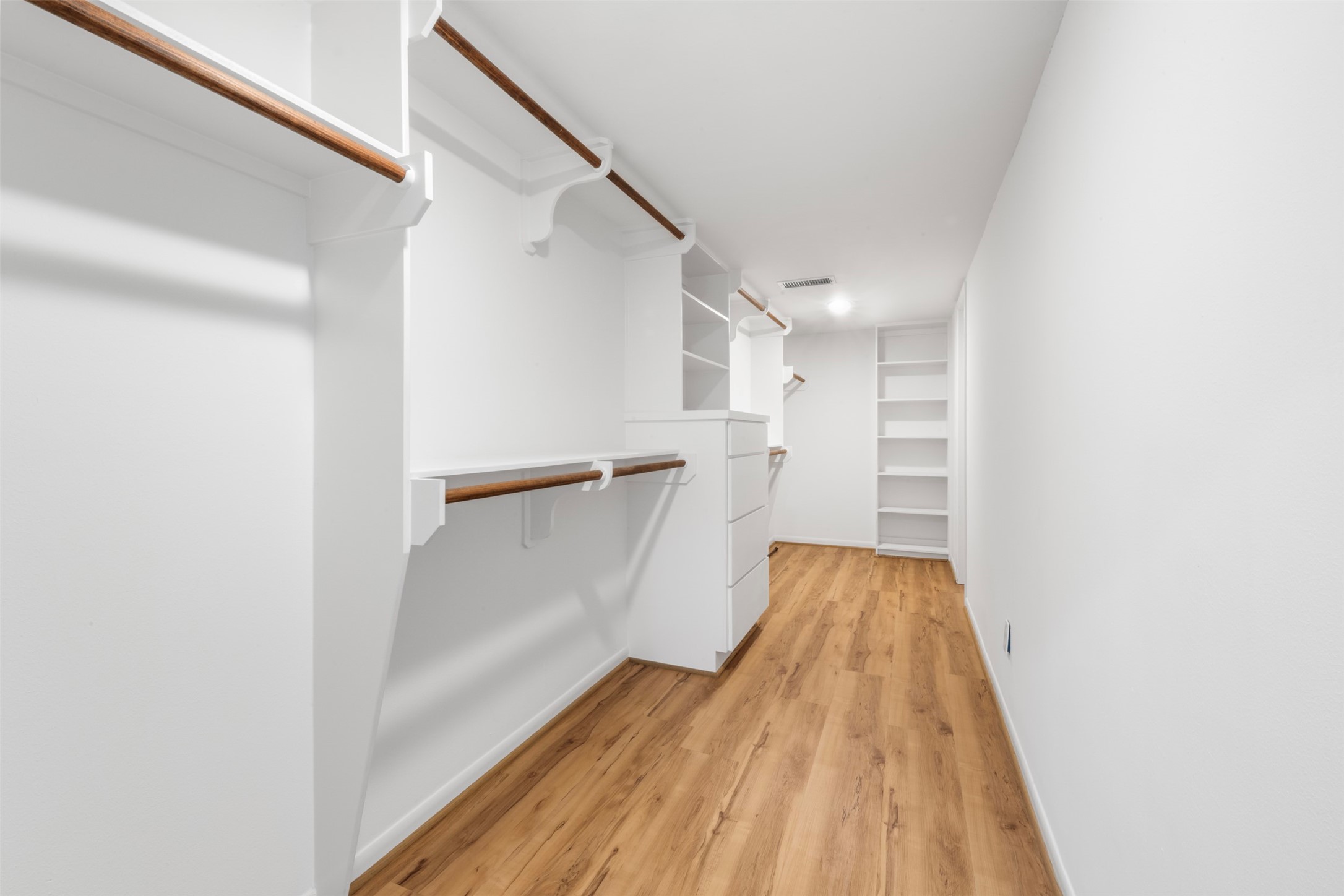 3141 Bissonnet Street Houston, TX 77005 - Photo 31 of 45 a view of walk in closet with empty racks