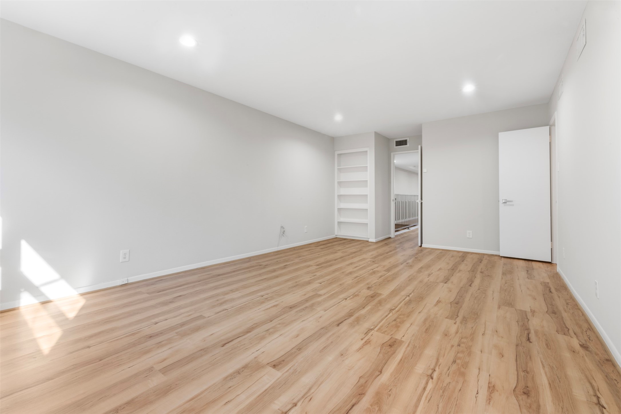 3141 Bissonnet Street Houston, TX 77005 - Photo 33 of 45 a view of empty room with wooden floor