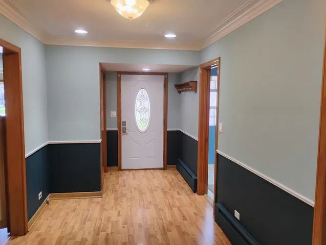 wooden floor in a hall with an entryway