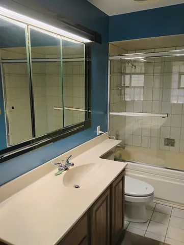 a view of hallway with wooden floor