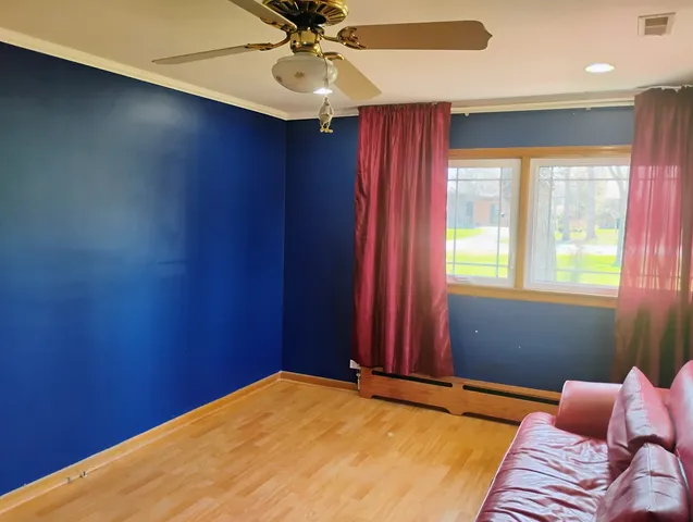 a living room with furniture and windows