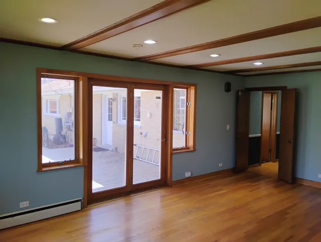 a blue bed sitting in a room next to a blue wall