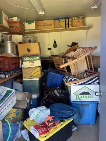 a kitchen with a stove and a bookshelf