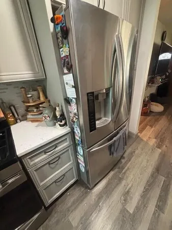 a utility room with wooden floor