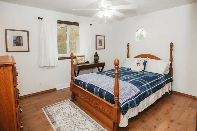 a bed room with a bed and window