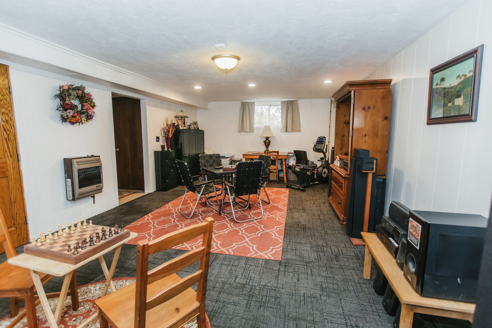 518 Brandywine Circle Varna, IL 61375 - Photo 24 of 44 a living room with furniture a flat screen tv and a refrigerator