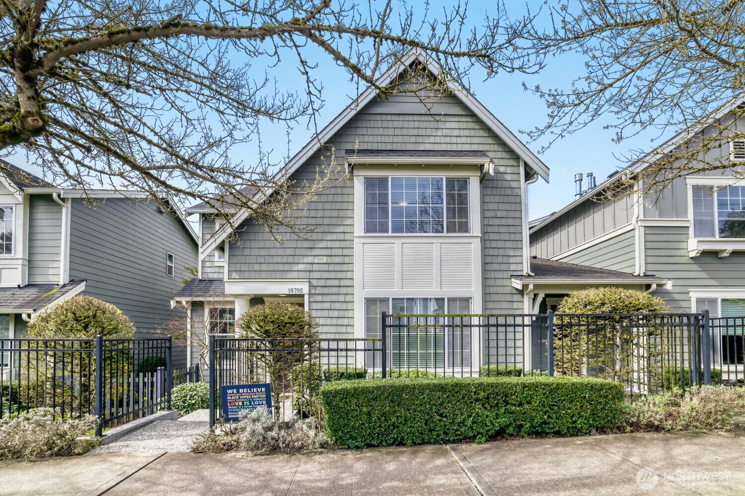 18705 101st Avenue Northeast, Unit 3 Bothell, WA 98011 - Photo 1 of 31 a front view of a house with garden