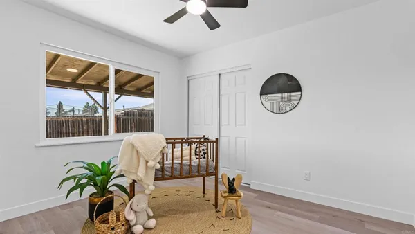 a view of a livingroom with furniture and hardwood floor