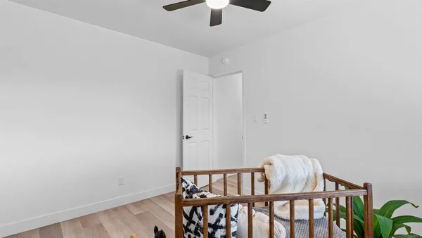 a view of hallway with a chandelier