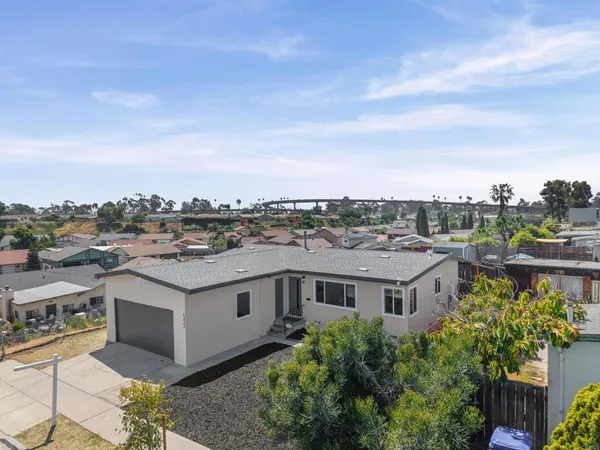 an aerial view of a house with a lake view