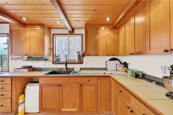 a stove top oven sitting inside of a kitchen
