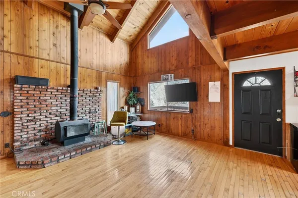 a view of balcony with wooden floor and fence