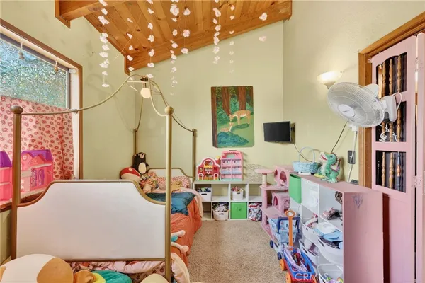a bedroom with furniture and wooden floor