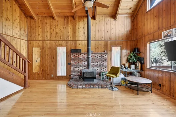 a view of living room kitchen and patio