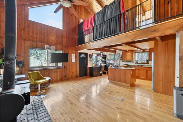 a kitchen with stainless steel appliances granite countertop a refrigerator a sink and a stove