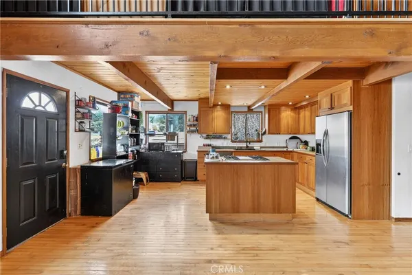 a kitchen with stainless steel appliances granite countertop a sink and cabinets
