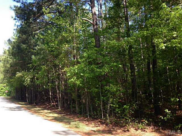 232 Bayleaf Drive, Unit 1 Raleigh, NC 27615 - Photo 2 of 5 a view of street along with trees