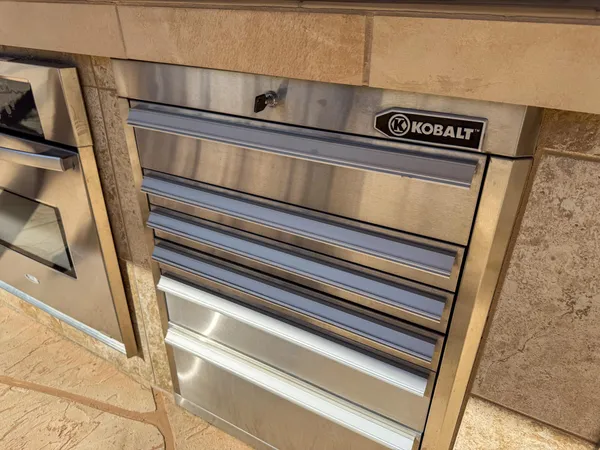 a view of a patio with table and chairs with wooden floor