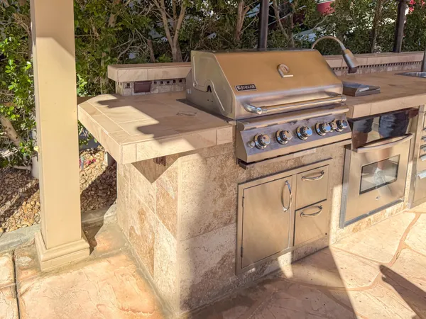 a outdoor sitting area with furniture and wooden floor