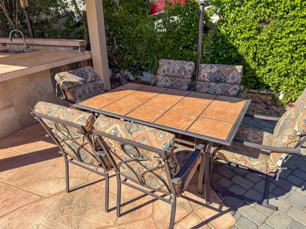 a view of a backyard with sitting area