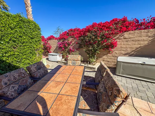 a view of a outdoor sitting area with golf course