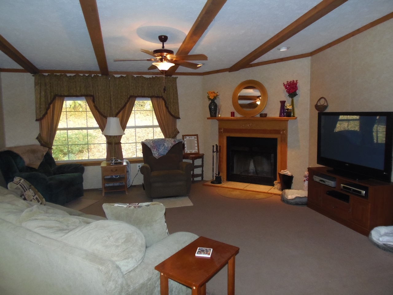 1612 Windsor Road Cheshire, MA 01225 - Photo 13 of 30 a living room with furniture a fireplace and a flat screen tv