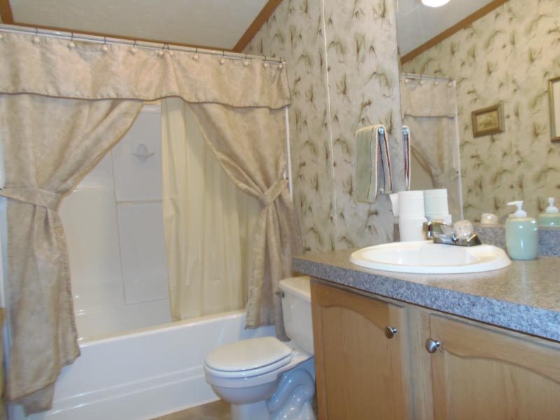 1612 Windsor Road Cheshire, MA 01225 - Photo 21 of 30 a bathroom with a granite countertop sink toilet and shower
