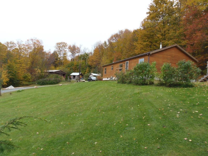1612 Windsor Road Cheshire, MA 01225 - Photo 5 of 30 a backyard of a house with lots of green space