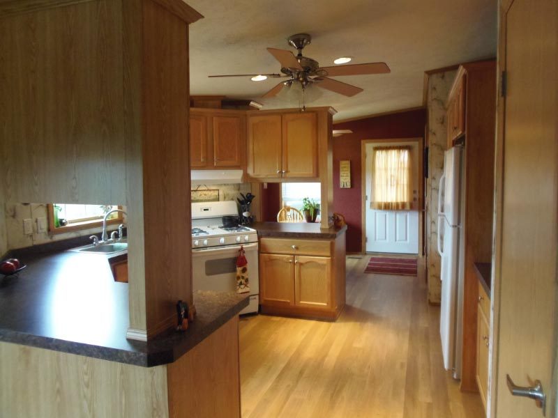 1612 Windsor Road Cheshire, MA 01225 - Photo 30 of 30 a kitchen with a refrigerator and a sink