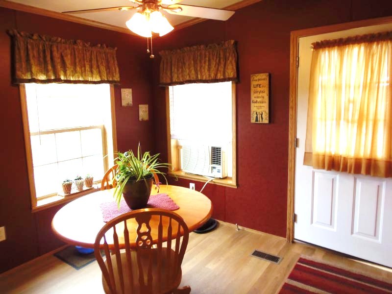 1612 Windsor Road Cheshire, MA 01225 - Photo 8 of 30 a view of a dining room with furniture wooden floor and chandelier