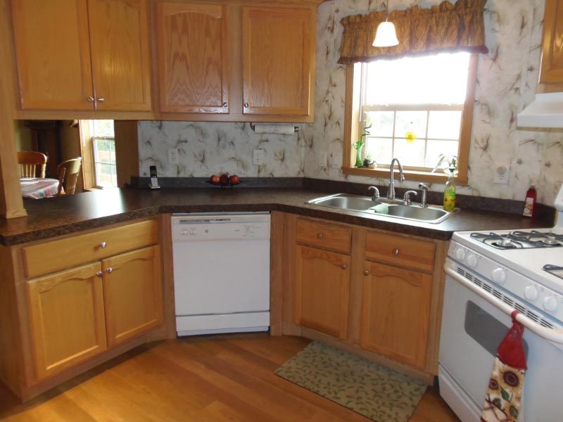 1612 Windsor Road Cheshire, MA 01225 - Photo 9 of 30 a kitchen with a sink stove and cabinets