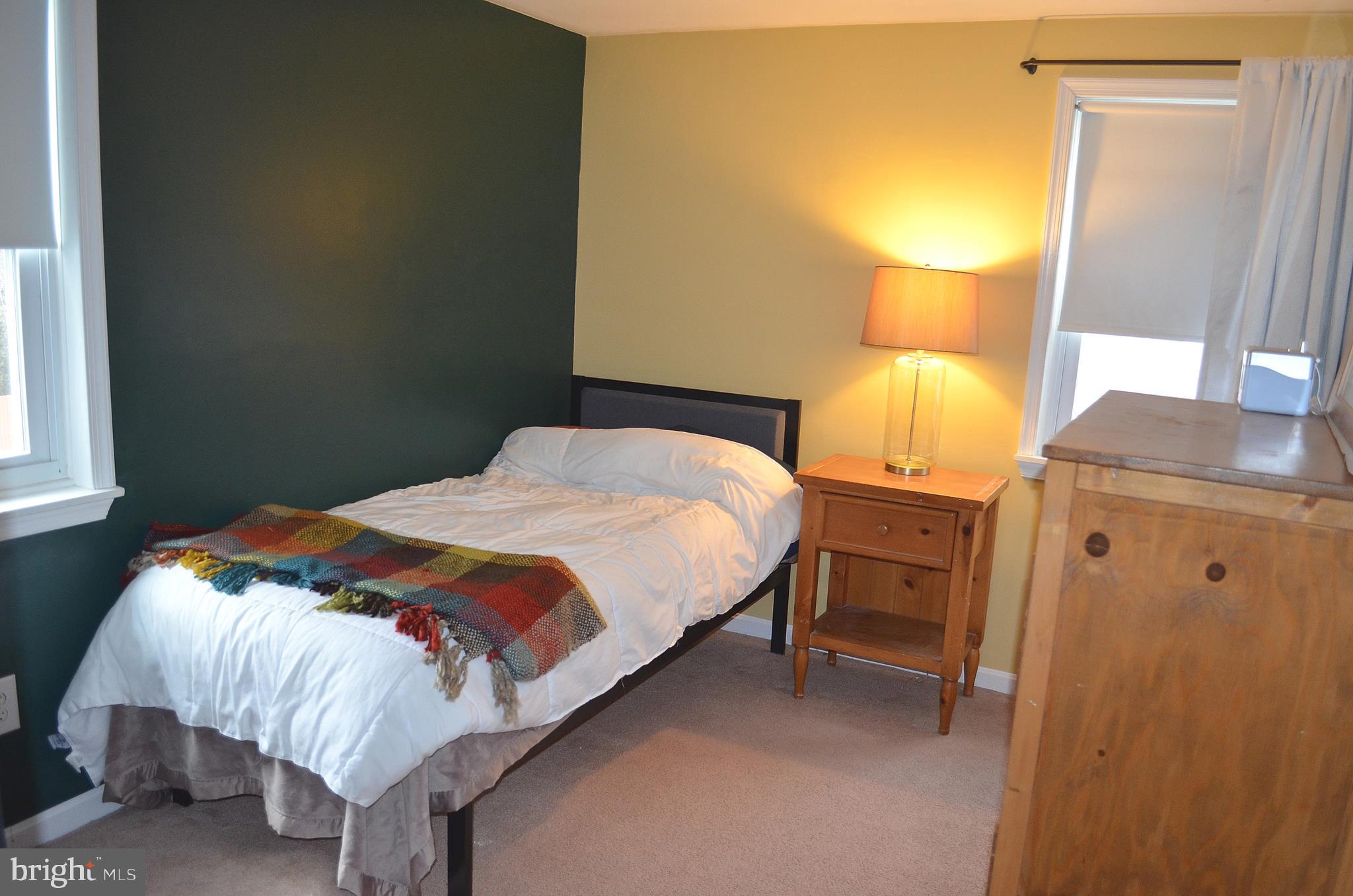 38 Barbara Road Hatboro, PA 19040 - Photo 22 of 36 a bedroom with a bed and a lamp