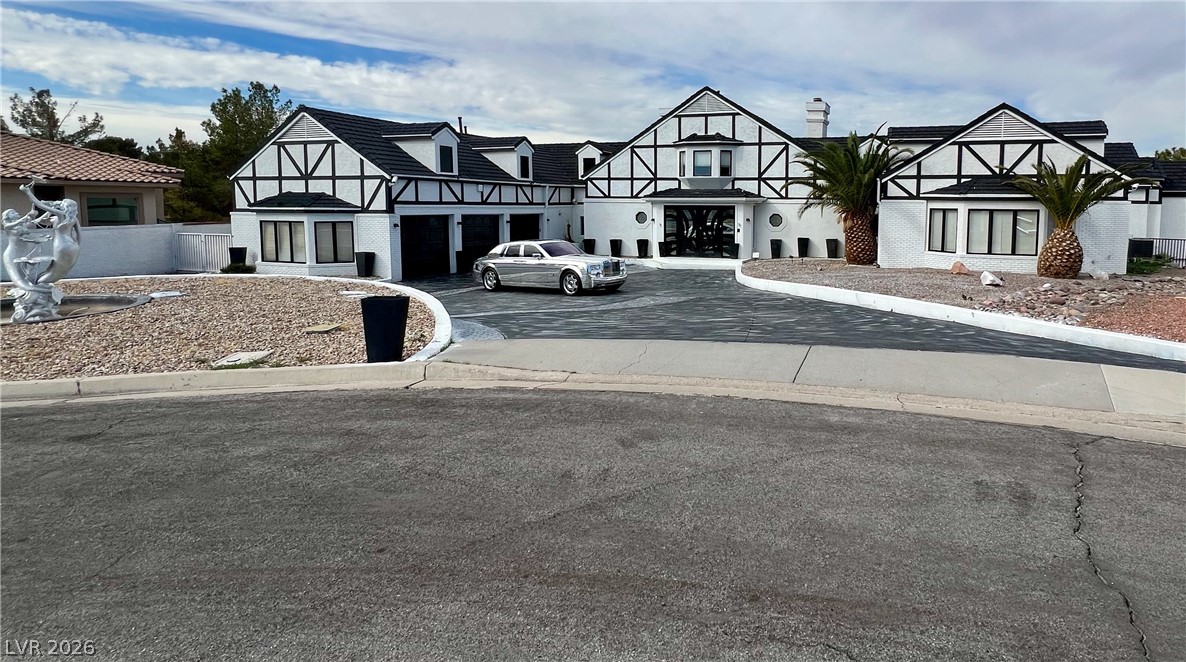3003 Regency Hill Henderson, NV 89014 - Photo 1 of 13 Architectural flair defines this property with its striking facade and inviting driveway.