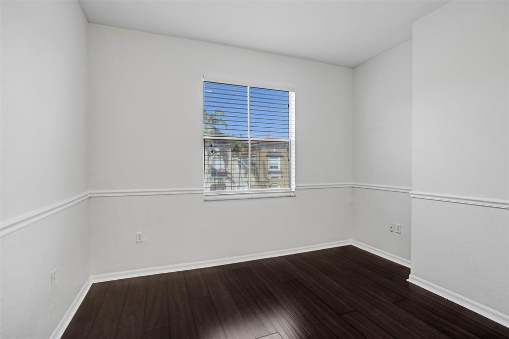 3533 Merrick Lane Margate, FL 33063 - Photo 15 of 27 a view of a room with wooden floor and windows in it