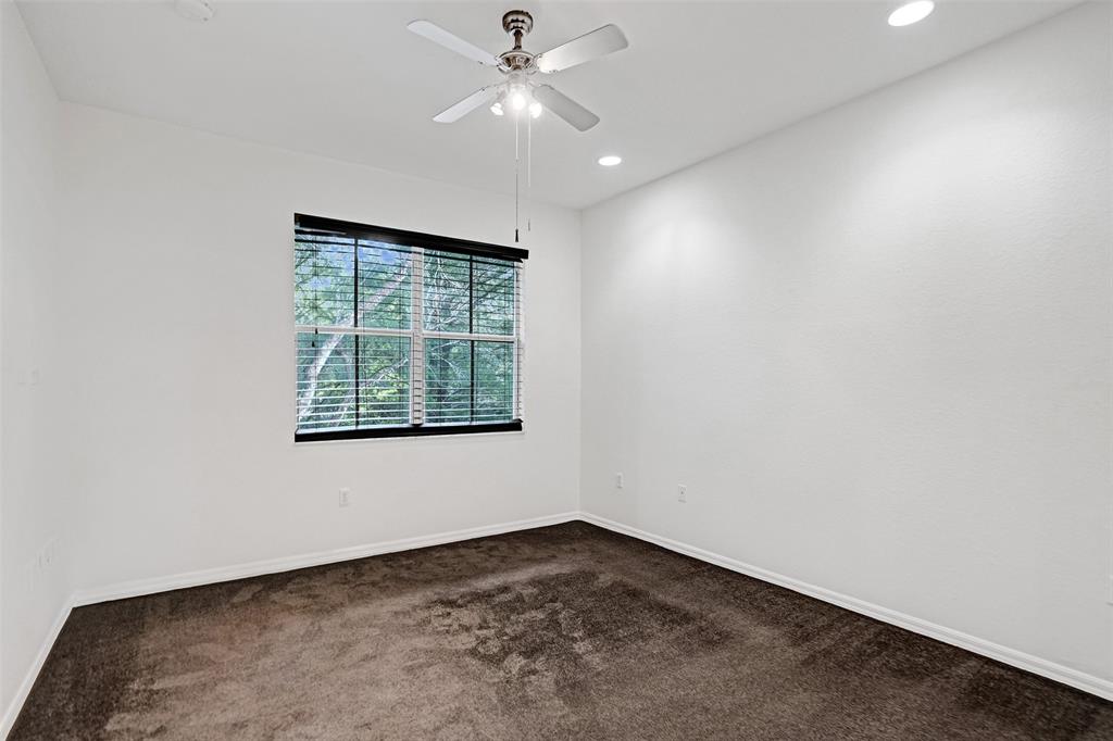 3533 Merrick Lane Margate, FL 33063 - Photo 17 of 27 an empty room with a window and a ceiling fan