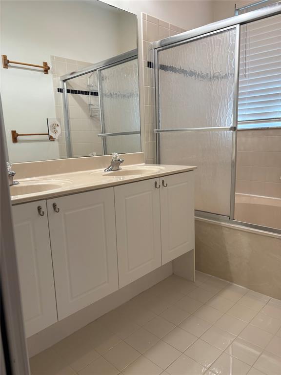 3533 Merrick Lane Margate, FL 33063 - Photo 10 of 14 a bathroom with a sink and mirror