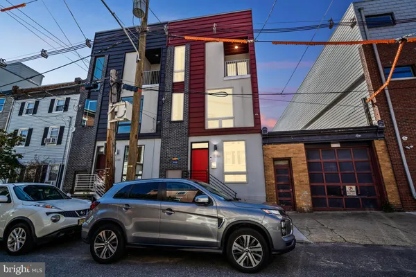 a view of a car parked in front of a building