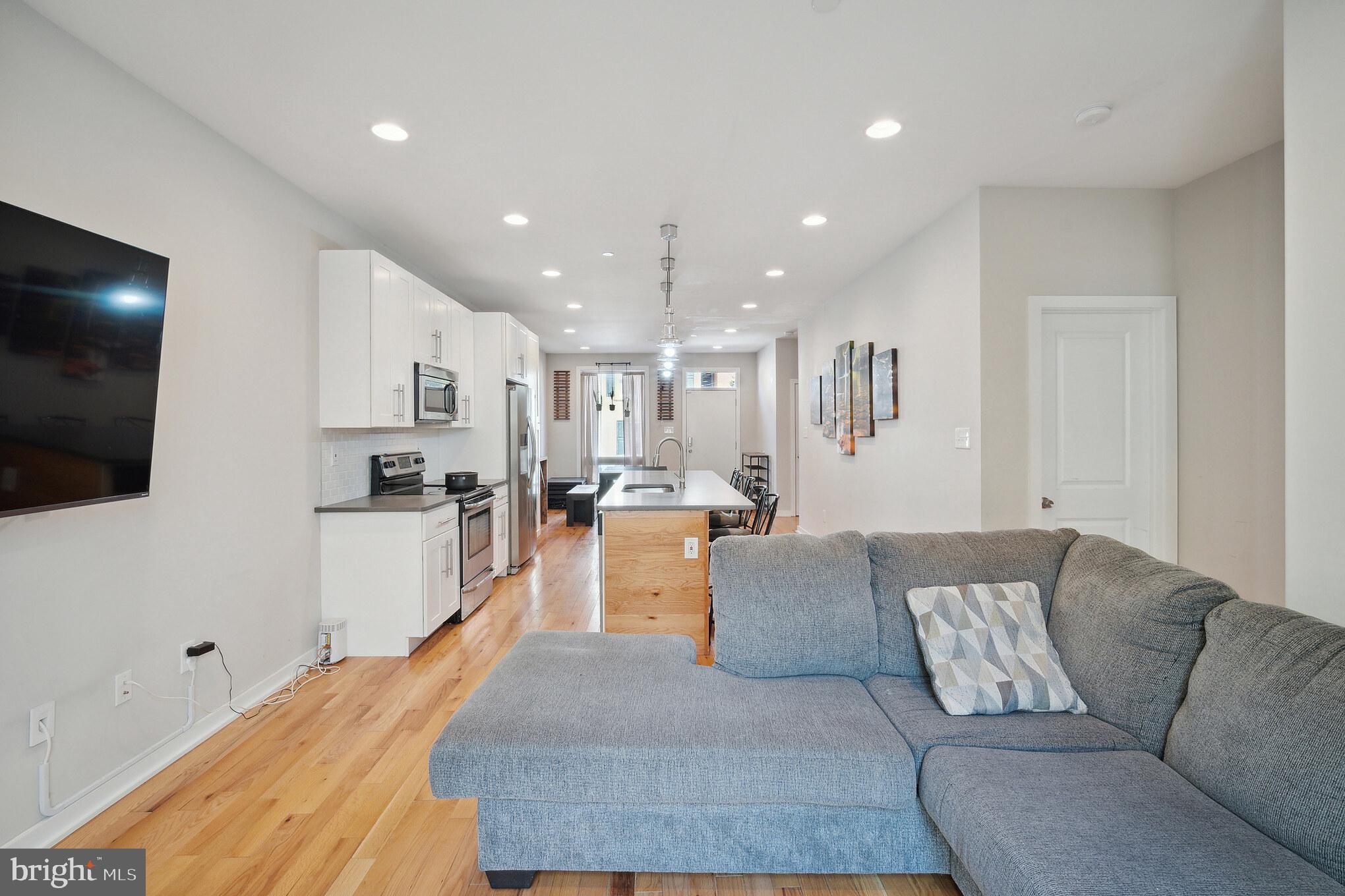 1246 East Fletcher Street Philadelphia, PA 19125 - Photo 11 of 29 a living room with furniture and a flat screen tv
