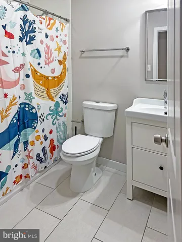 a bathroom with a toilet and sink