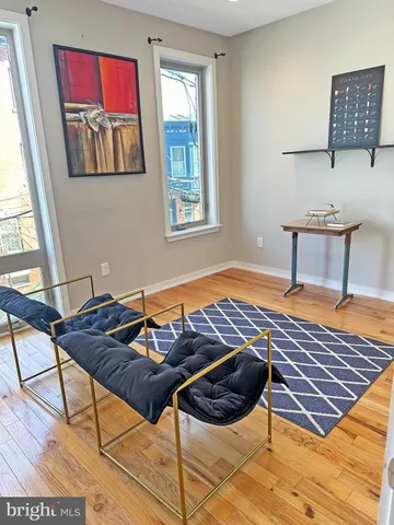 a bedroom with furniture and window