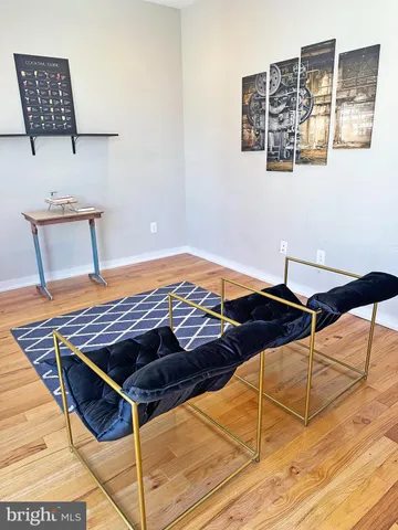 a bed sitting in a bedroom next to a lamp