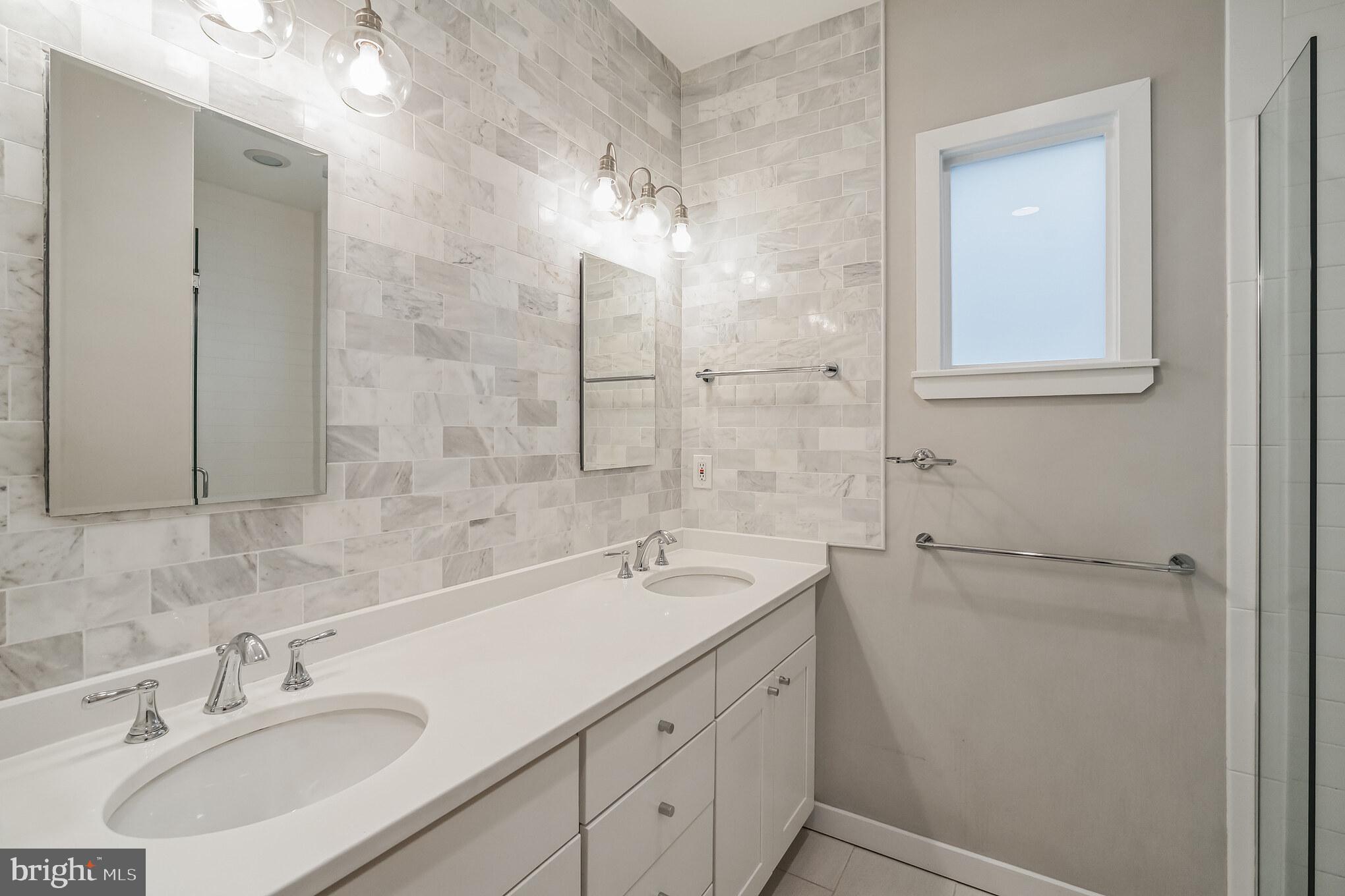 1246 East Fletcher Street Philadelphia, PA 19125 - Photo 24 of 29 a bathroom with a sink and a mirror