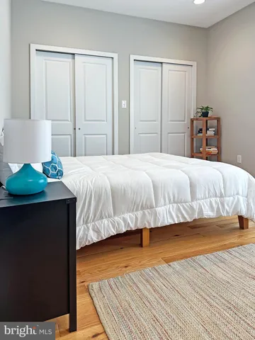 a bedroom with a bed and a table