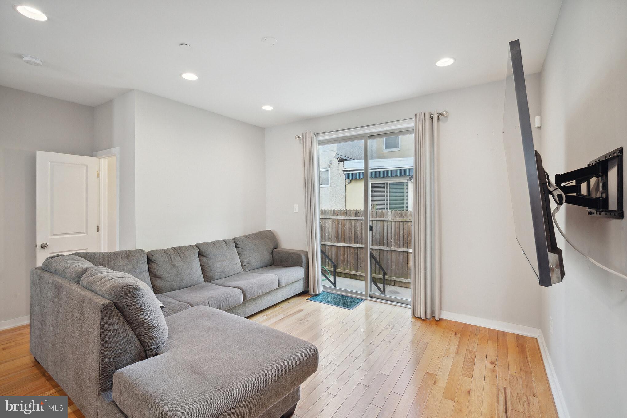 1246 East Fletcher Street Philadelphia, PA 19125 - Photo 10 of 29 a living room with furniture and a couch