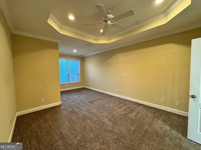 a view of an empty room and a window