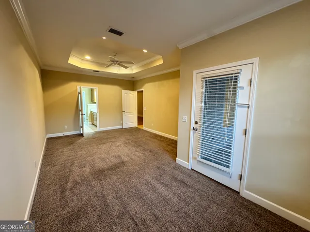 a bathroom with a tub a sink and mirror