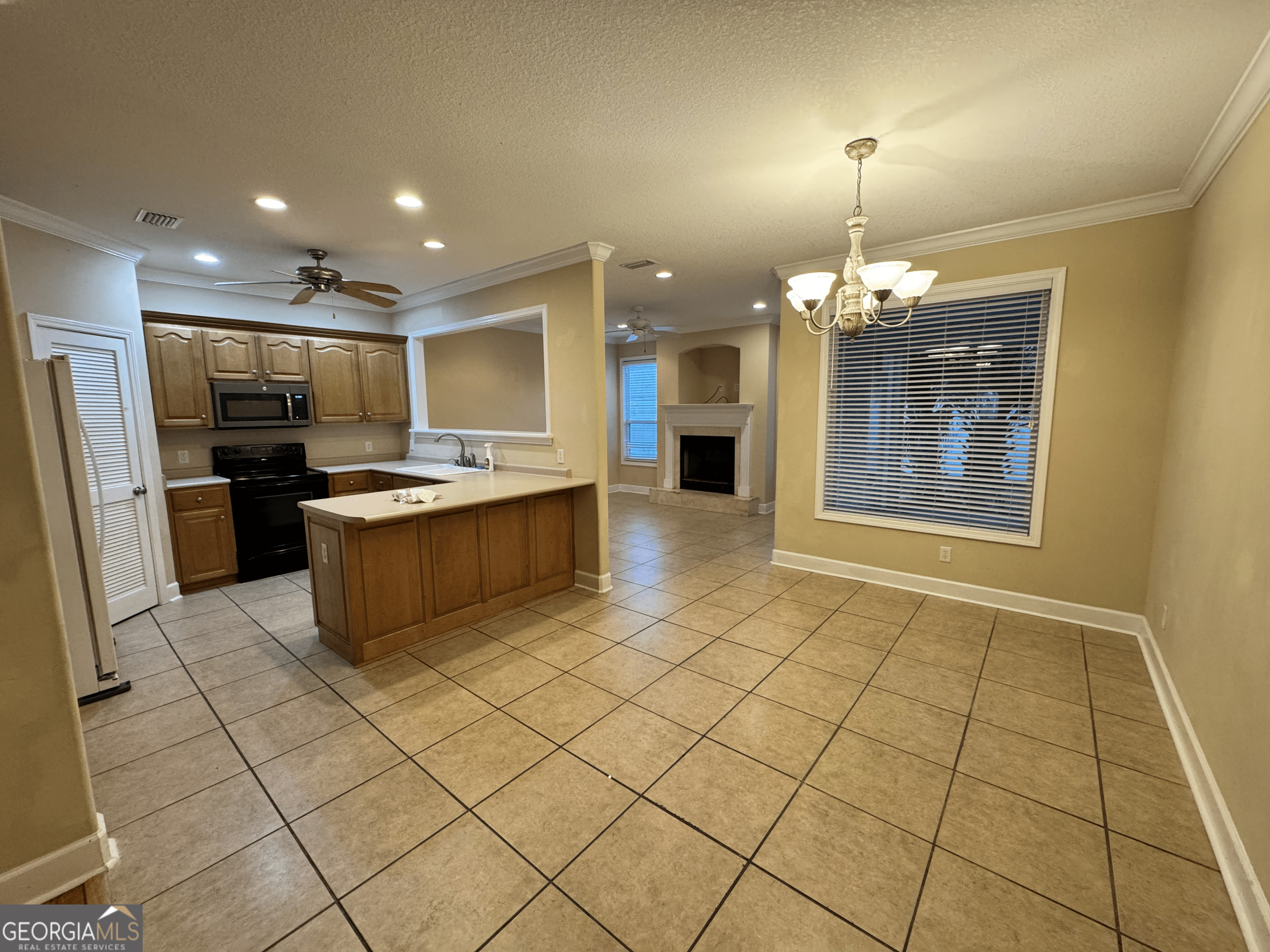217 Austin Ryan Drive Kingsland, GA 31548 - Photo 6 of 26 a kitchen with stainless steel appliances granite countertop a refrigerator and a sink