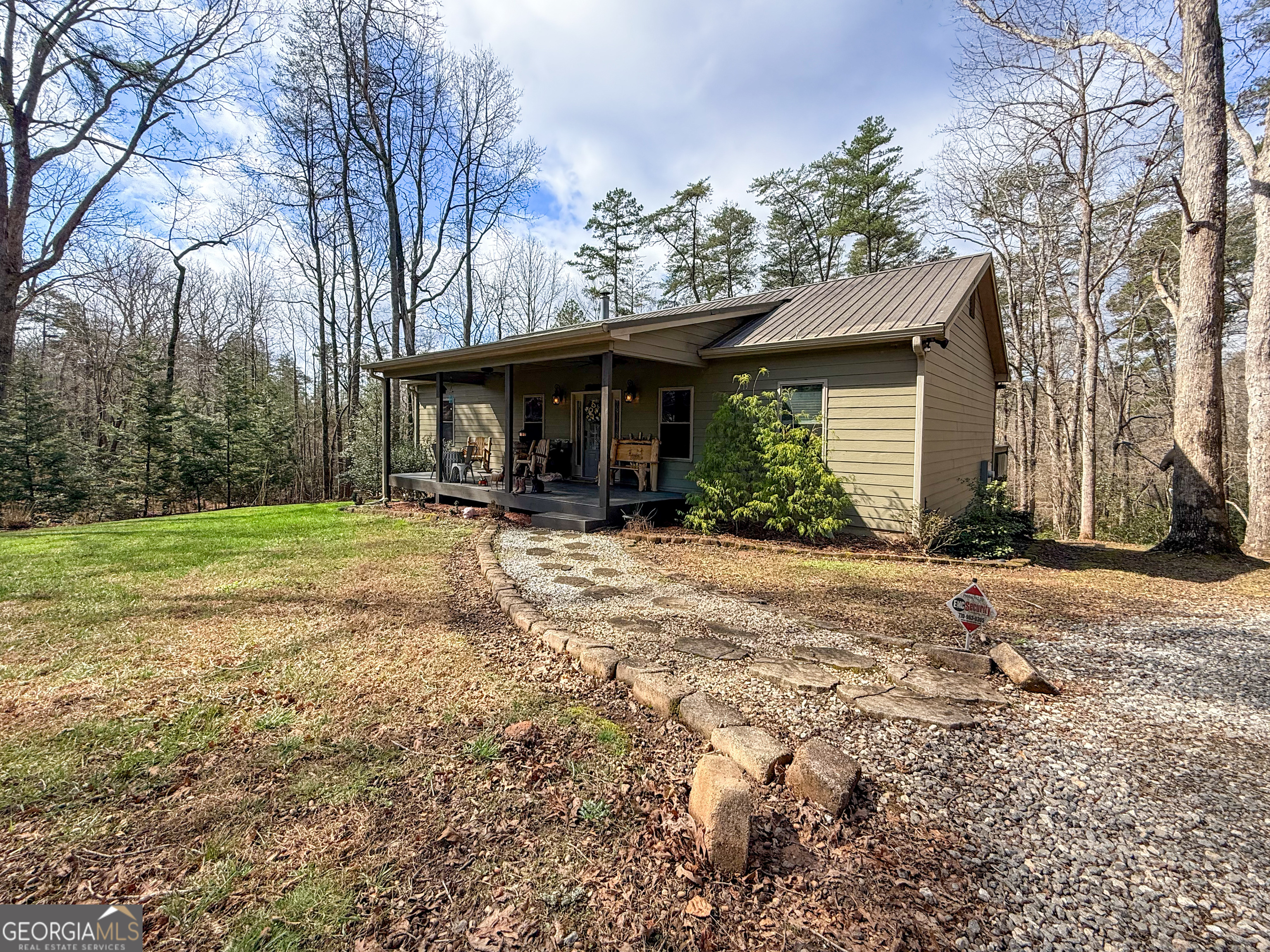186 Holly Lane Cleveland, GA 30528 - Photo 2 of 58 a house with trees in the background